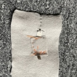 I sowed on the conductive thread to one of the peices of conductive fabric. At this point it stopped working completely and I put it down for the day.