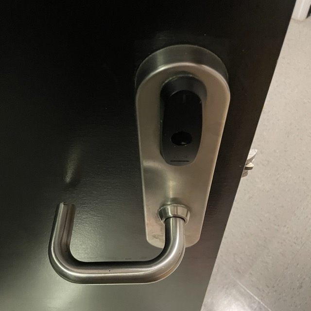 the door to a sheridan residence room being unlocked and opened. a familiar sound with an intresting melody.