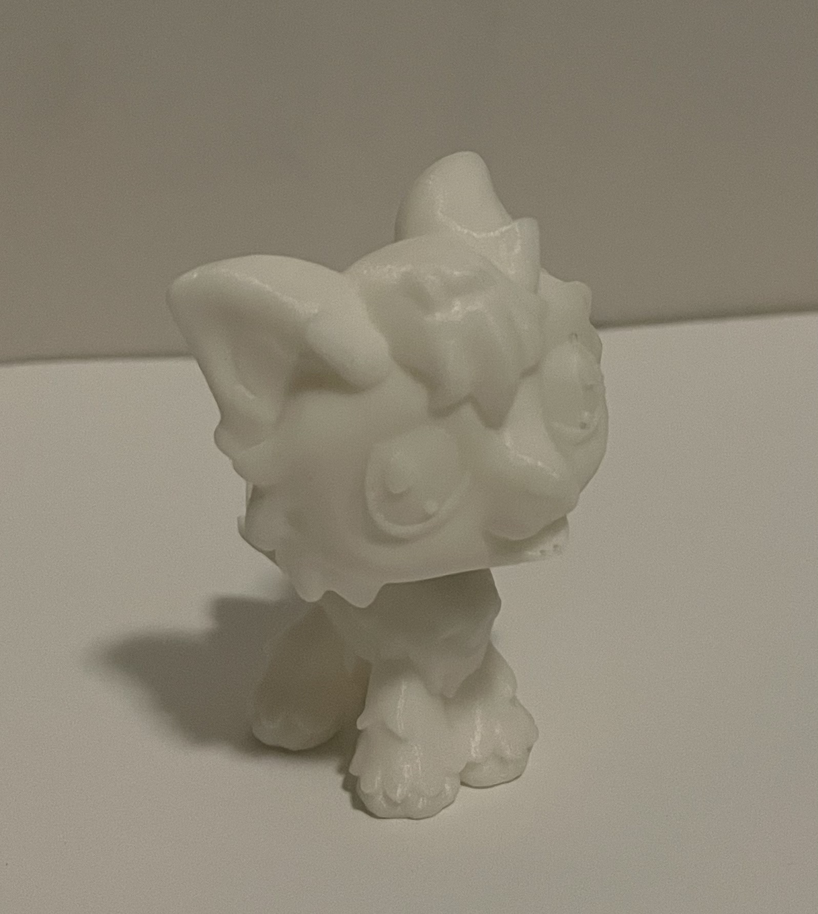 This is the 3d print of the wolf littlest pet shop figure with a spring in the neck added to replace the ball joint used in the modern toys to pay homage to the older generation of this toy. The irises and lights in the eye are extruded along with text on the back of the head reading LPS, a small tounge, and a small extrude in the ear to represent the two shades of grey on the real life toy. there is a small hole in the foot that the real toy has to allow it to stay standing on moving play sets even though the figure is quite top heavy.
                         <div class='container2'><img src='images/final/dog2.jpeg'</div><div class='container2'><img src='images/final/dog3.jpeg'</div>